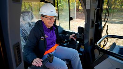 Alfred University administration operating a bulldozer